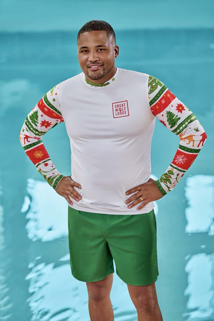 a man wearing a christmas themed swimwear